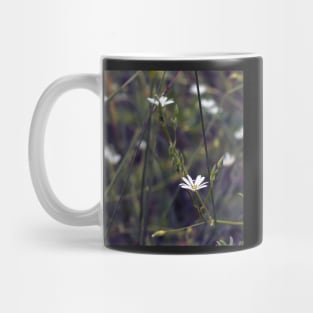 Tiny white flower on the grass background Mug